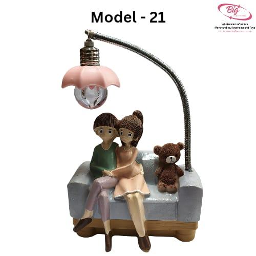 Couple sitting  on blue sofa with teddy  lamp Model 21